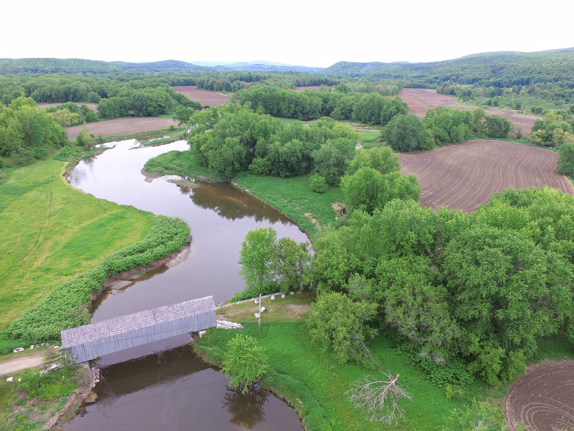 The Housatonic River meanders below the historic covered bridge in Sheffield, Massachusetts.